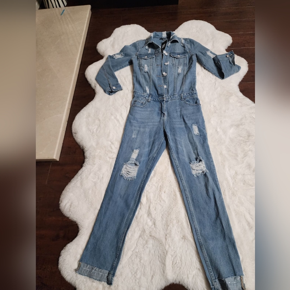 Denim distressed long sleeve jumpsuit